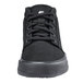 A close up of a black Shoes For Crews Cabbie II men's shoe with laces.