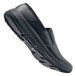A black Shoes For Crews men's slip-on shoe with rubber soles.