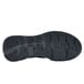 The black rubber sole of a Shoes For Crews Vitality II women's athletic shoe.