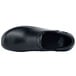 A black leather MOZO clog with a rubber sole.