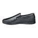 A black Shoes For Crews slip-on shoe with a rubber sole.