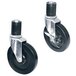 Two black and silver Advance Tabco casters with wheels on them.