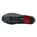 A black leather Shoes For Crews Delray casual shoe with red laces.