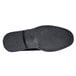 The bottom of a black Shoes For Crews Cambridge dress shoe with a sole.