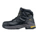 A black work boot with yellow accents on the laces and sole.