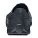 a black shoe with a white background