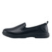 A black Shoes For Crews Quincy women's slip-on shoe with a rubber sole.