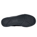 The black rubber sole of a black Shoes For Crews Milano women's shoe.
