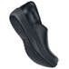 A black MOZO slip-on shoe with a black sole.
