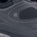 A close up of a black Shoes For Crews Revolution II women's athletic shoe.