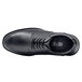 A black Shoes For Crews men's leather dress shoe with laces.