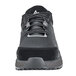 A black and gray ACE women's athletic shoe with laces.