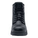 A close-up of a black Shoes For Crews work boot with laces and a rubber sole.