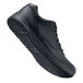 A black Shoes For Crews Liberty women's athletic shoe with red laces and soles.