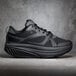 A close up of a black Shoes For Crews Energy II athletic shoe.