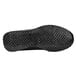 The textured sole of a black Shoes For Crews Avery women's athletic shoe.
