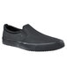 A black Shoes For Crews Ollie II slip-on shoe with a black rubber sole.