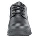 A black Shoes For Crews work boot for men with laces.