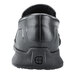 The back of a black Shoes For Crews Mason slip on shoe with a rubber sole.
