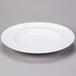 a white plate on a gray surface