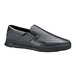 A black Shoes For Crews slip-on shoe with a rubber sole.