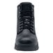 A close-up of a black Shoes For Crews work boot with laces.