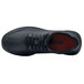 A black water-resistant shoe with a red sole.