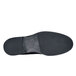 A close-up of a black Shoes For Crews Senator steel toe dress shoe with a black sole.