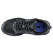 A black Shoes For Crews Energy II athletic shoe with a blue sole.