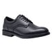 A black Shoes For Crews men's dress shoe with laces.