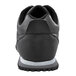 The back of a black Shoes For Crews Avery sneaker with a white sole.