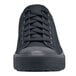 A close up of a black Shoes For Crews Delray shoe with laces.