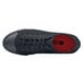 a black shoe with red logo