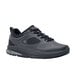 A black Shoes For Crews women's athletic shoe with laces.