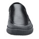 Shoes For Crews black slip-on shoe with a rubber sole.