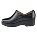 A black leather Shoes For Crews Juno women's non-slip shoe with a rubber sole.