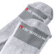 A pair of white and grey Ace over-calf socks.