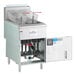 A stainless steel floor fryer with two fryer baskets and an open lower compartment, designed for commercial use.