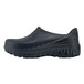 A black Shoes for Crews men's clogger shoe with rubber soles.