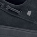 A close up of a black Shoes For Crews Milano women's casual shoe on a table.