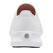 A white Shoes For Crews women's athletic shoe with a white sole and a logo on the bottom.