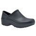 A black Shoes For Crews women's clogger shoe with rubber soles.