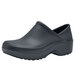 A black Shoes For Crews clogger with rubber soles.