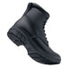 A close up of a black Shoes For Crews work boot with laces and rubber soles.