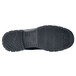 A close-up of a black Shoes For Crews work boot with rubber soles.