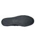 A black Shoes For Crews canvas shoe with a black rubber sole.