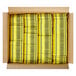 A cardboard box of yellow Crayola crayons.