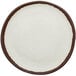 A white plate with brown rim.