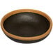 A brown bowl with a black and brown clay trim.