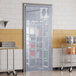 A kitchen with a Curtron Polar Reinforced Strip Door open.